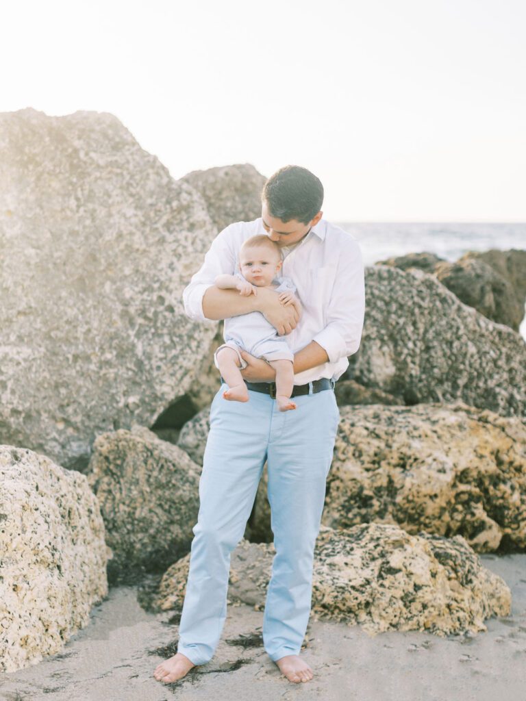 dad kissing baby boy