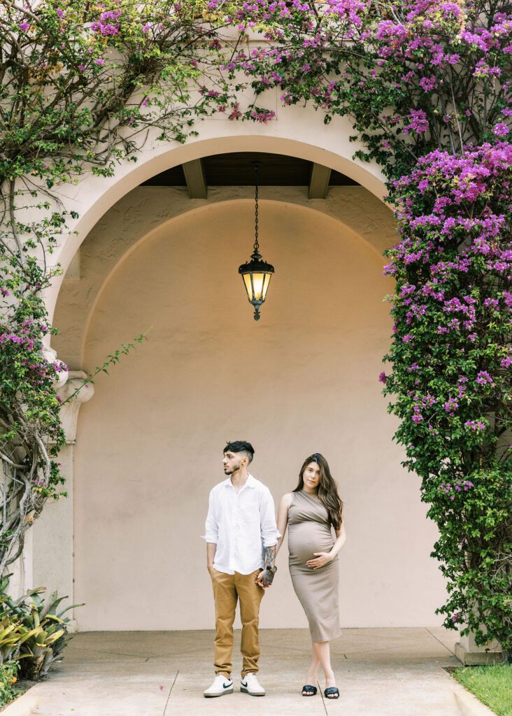 Couple holding hands during maternity session in West Palm Beach