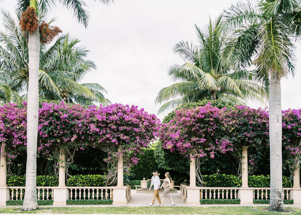 Couple walking holding hands in maternity session in west palm beach